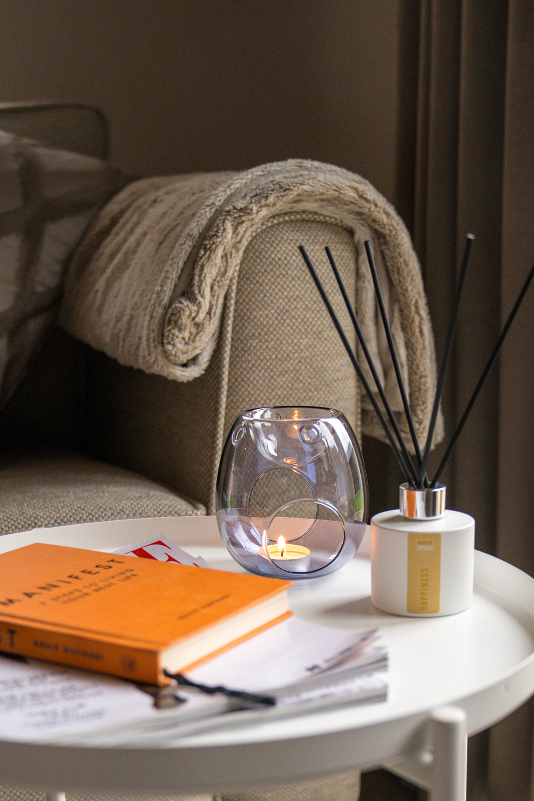 Handmade reed diffuser with reeds in a stylish home