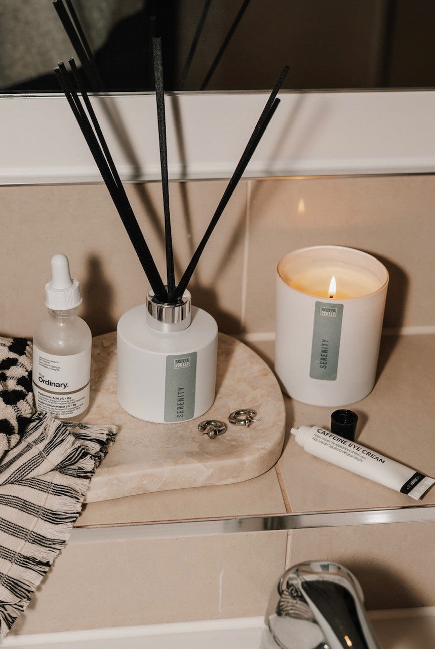 Handmade reed diffuser adding fragrance to a bathroom